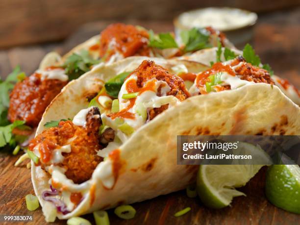 crispy baked buffalo wing cauliflower tacos - buffalo chicken wings stock pictures, royalty-free photos & images