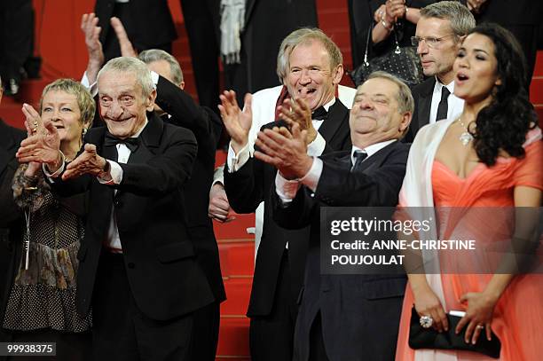 French French actor Jacques Herlin, French actor Xavier Maly, guest and French actress Sabrina Ouazani applaud the director Xavier Beauvois after the...