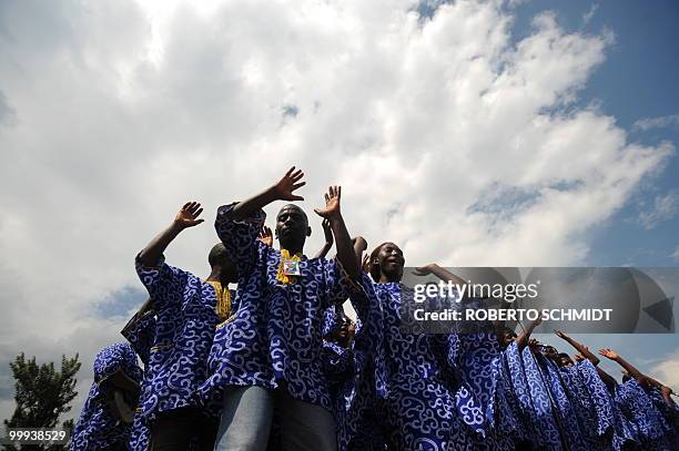 Burundi's Nkurunziza on God and grassroots development** Members of a chorus sing during a political rally by Burundian President Pierre Nkurunziza...