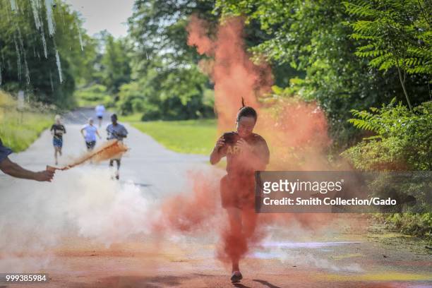 Army National Guard Soldier crossing the finish line at the 2018 New Jersey National Guard LGBT Color Run, Joint Base McGuire-Dix-Lakehurst, New...