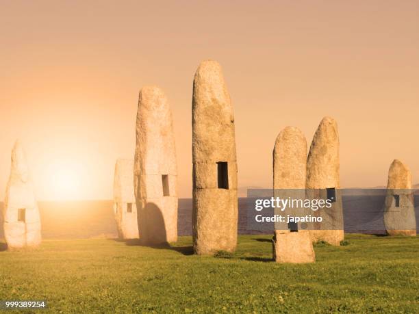 menhirs in the public park of the sculptures in la coruña - menhir stock-fotos und bilder