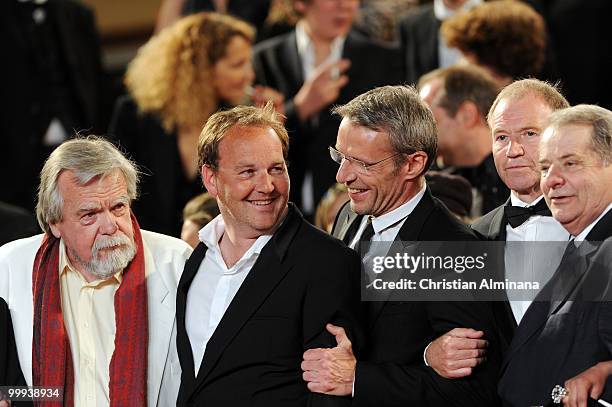 Actor Michael Lonsdale, director Xavier Beauvois and actor Lambert Wilson departs the "Of Gods And Men" Premiere at the Palais des Festivals during...