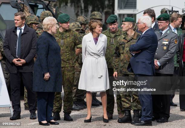 German President Frank-Walter Steinmeier, his wife Elke Buedenbender and the President of the Republic of Lithuania, Dalia Grybauskaité , being shown...
