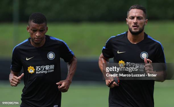 Henrique Dalbert and Danilo D Ambrosio of FC Internazionale run during the FC Internazionale training session at the club's training ground Suning...