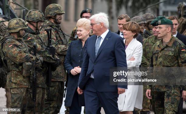 German President Frank-Walter Steinmeier, his wife Elke Buedenbender and the President of the Republic of Lithuania, Dalia Grybauskaité , being shown...