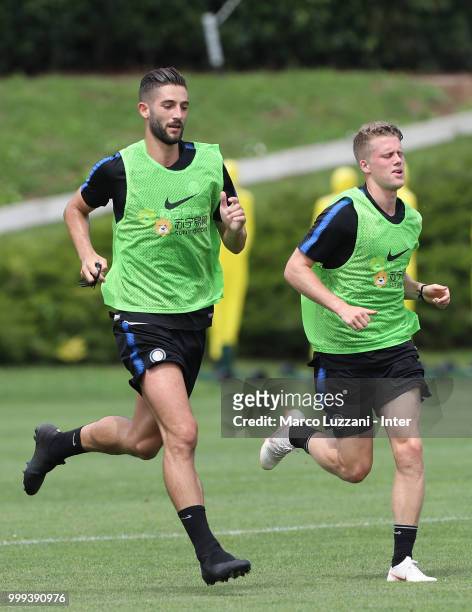 Roberto Gagliardini and Emmers Xian Ghislaine of FC Internazionale run during the FC Internazionale training session at the club's training ground...