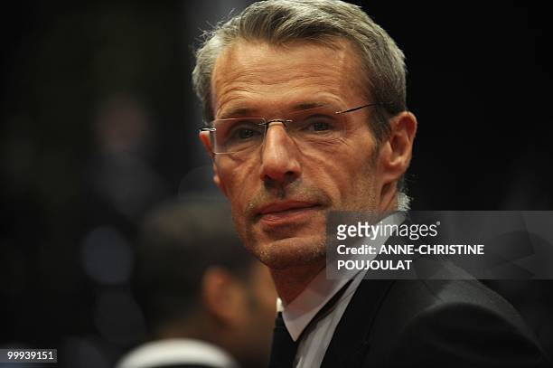 French actor Lambert Wilson leaves after the screening of "Des Hommes et des Dieux" presented in competition at the 63rd Cannes Film Festival on May...