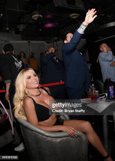 Model Jessica Weaver and producer Dave Bryant react during "Foxy Boxing" as she hosts Larry Flynt's Hustler Club Instagram party at Larry Flynt's...