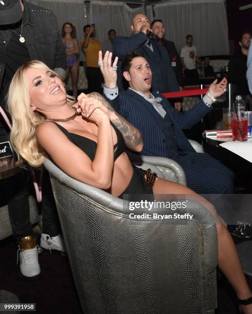 Model Jessica Weaver and producer Dave Bryant react during "Foxy Boxing" as she hosts Larry Flynt's Hustler Club Instagram party at Larry Flynt's...