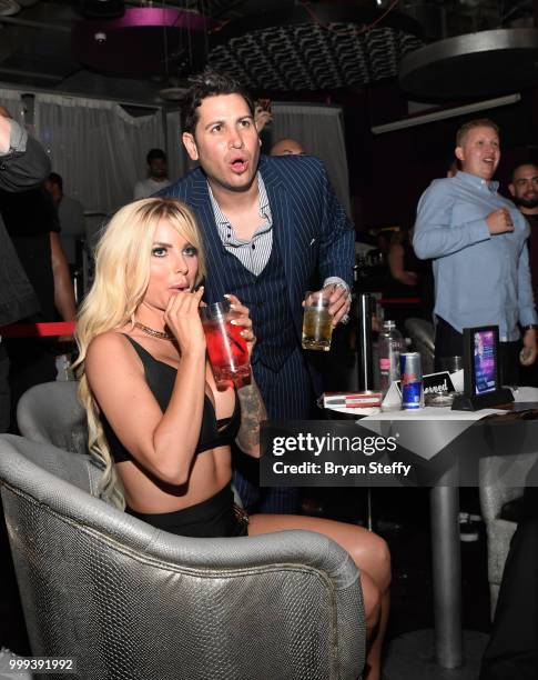 Model Jessica Weaver and producer Dave Bryant react during "Foxy Boxing" as she hosts Larry Flynt's Hustler Club Instagram party at Larry Flynt's...