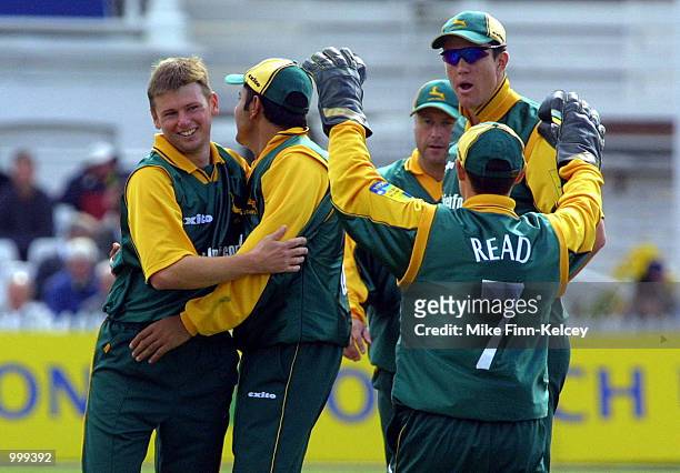 Andrew Harris of Nottinghamshire celebrates after claiming the wicket of Trevor Ward of Leicestershire in the Norwich Union League match between...