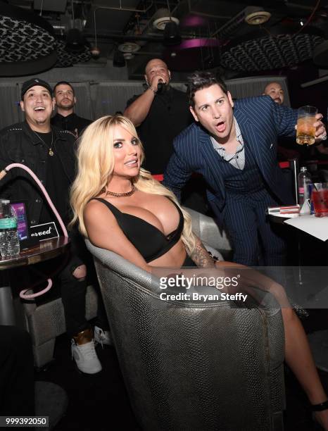 Model Jessica Weaver and producer Dave Bryant react during "Foxy Boxing" as she hosts Larry Flynt's Hustler Club Instagram party at Larry Flynt's...