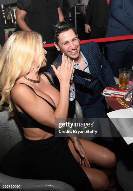 Model Jessica Weaver and producer Dave Bryant react during "Foxy Boxing" as she hosts Larry Flynt's Hustler Club Instagram party at Larry Flynt's...