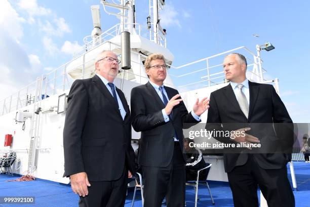 The Economy Minister of the state of Schleswig-Holstein, Bernd Buchholz , speaking with Senior Captain Johannes Wasmuth and the head of the...