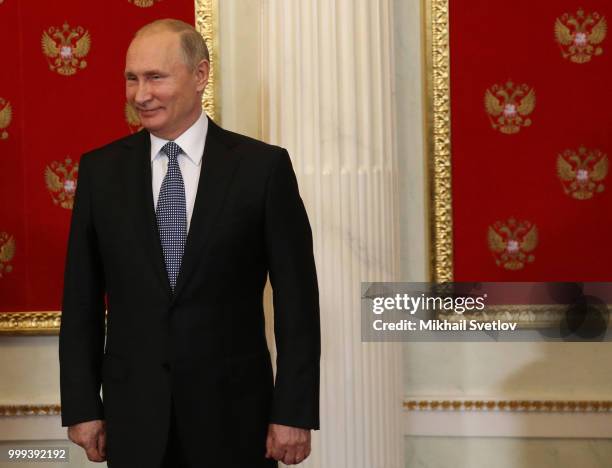 Russian President Vladimir Putin smiles during the ceremony at the Kremlin, in Moscow, Russia, July 2018. Qatar is hosting FIFA World Cup in 2022.