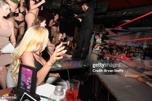 Model Jessica Weaver judges contestants competing in "Foxy Boxing" as she hosts Larry Flynt's Hustler Club Instagram party at Larry Flynt's Hustler...