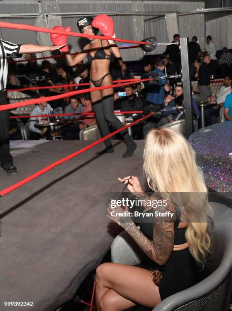 Model Jessica Weaver judges contestants competing in "Foxy Boxing" as she hosts Larry Flynt's Hustler Club Instagram party at Larry Flynt's Hustler...