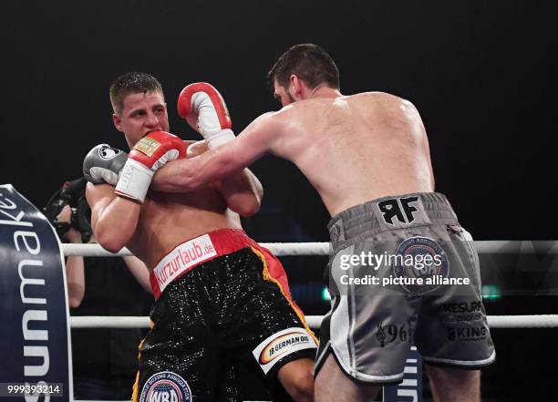 July 2018, Germany, Offenburg: Boxing: WBA super middleweight title fight. Tyron Zeuge of Germany fighting Rocky Fielding of Britain. Fielding won on...