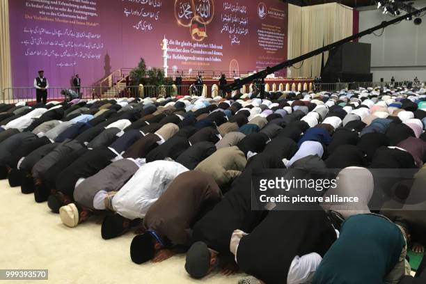 Muslims are praying and listening to the sermon at annual general meeting of the Ahmadiyya Muslim Jamaat in Rheinstetten, Germany, 25 August 2017....