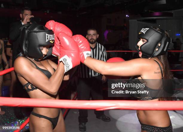 Contestants compete in "Foxy Boxing" during Larry Flynt's Hustler Club Instagram party hosted by Jessica Weaver at Larry Flynt's Hustler Club on July...