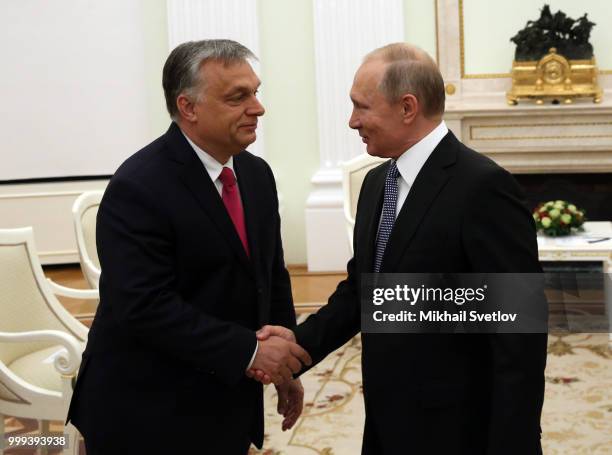 Russian President Vladimir Putin greets Hungarian Prime Minister Viktor Orban during their talks at the Kremlin, in Moscow, Russia, July 2018. Orban...