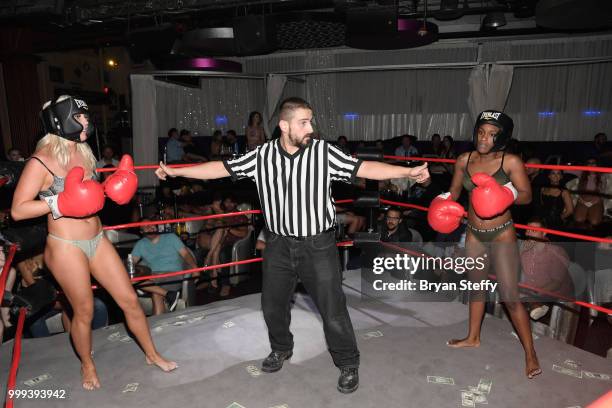 Contestants compete in "Foxy Boxing" during Larry Flynt's Hustler Club Instagram party hosted by Jessica Weaver at Larry Flynt's Hustler Club on July...