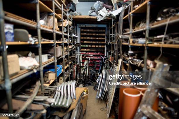 Opel spare parts lie in a hall owend by the Degener brothers in Vreden, Germany, 06 July 2017. The brothers have been collecting Opel vintage cars...