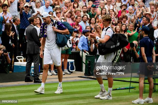 Kevin Anderson of South Africa applauds John Isner of the United States as he leaves the court after their semi final match in the gentlemen's...