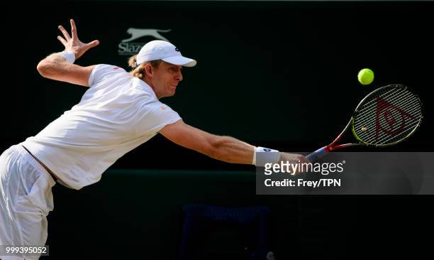 Kevin Anderson of South Africa in action against John Isner of the United States in the semi final of the gentlemen's singles at the All England Lawn...