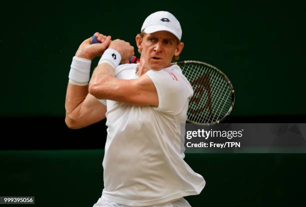 Kevin Anderson of South Africa in action against John Isner of the United States in the semi final of the gentlemen's singles at the All England Lawn...