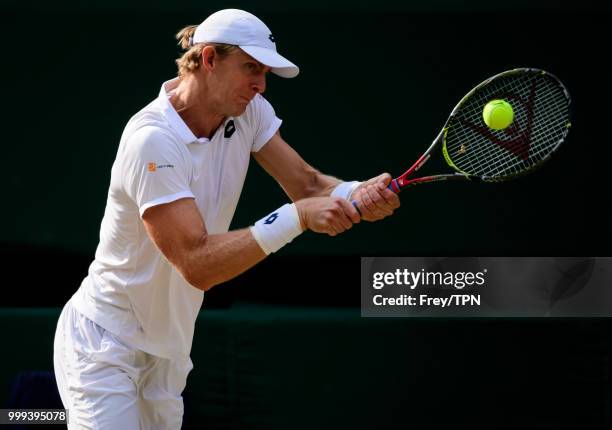 Kevin Anderson of South Africa in action against John Isner of the United States in the semi final of the gentlemen's singles at the All England Lawn...