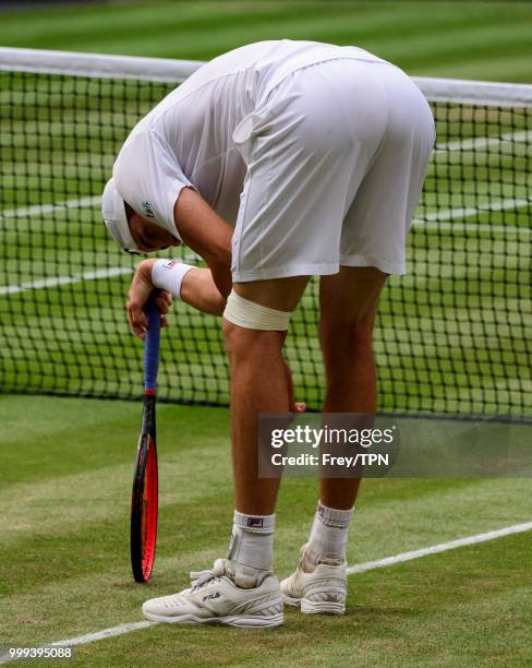 John Isner of the United States looks dejected against Kevin Anderson of South Africa in the semi final of the gentlemen's singles at All England...