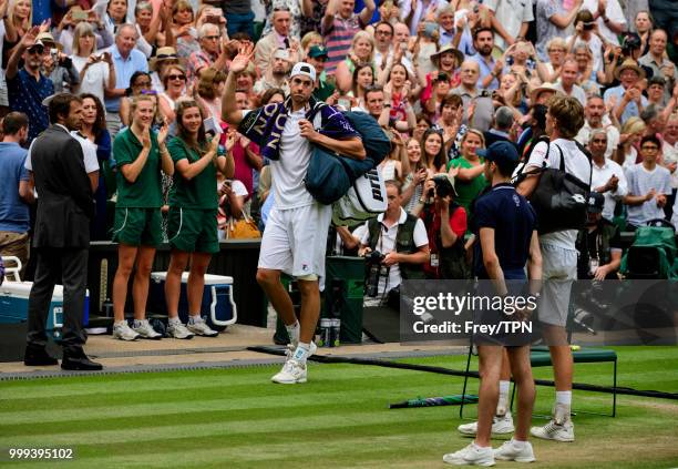 Kevin Anderson of South Africa applauds John Isner of the United States as he leaves the court after their semi final match in the gentlemen's...