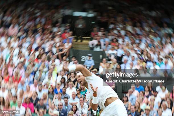 Mens Singles, Semi-Final - Rafael Nadal v Novak Djokovic - An abstract view of Rafael Nadal as he serves at All England Lawn Tennis and Croquet Club...