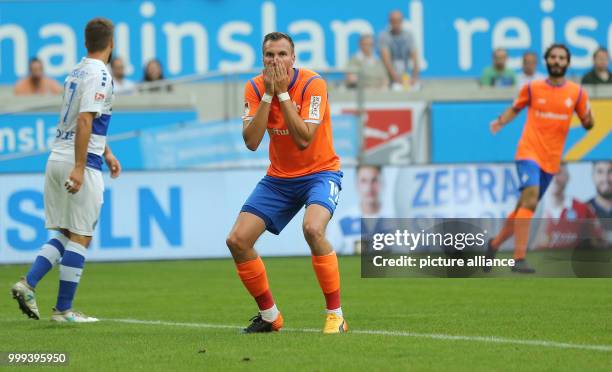 Darmstadt's Kevin Grosskreutz reacts after a missed chance during the German 2nd Bundesliga soccer match between MSV Duisburg and Darmstadt 98 in the...