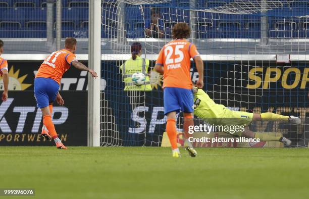 Duisburg's keeper Mark Flekken saves a penalty by Darmstadt's Tobias Kempe during the German 2nd Bundesliga soccer match between MSV Duisburg and...