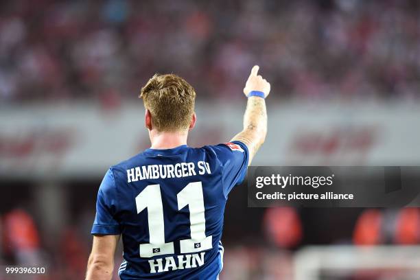 Andre Hahn celebrates his goal during the German Bundesliga soccer match between 1. FC Cologne and Hamburger SV in the RheinEnergieStadium in...