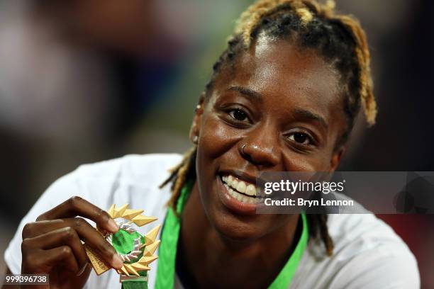 Lorraine Ugen of Great Britain celebrates with her gold medal after winning the Women's long jump at London Stadium on July 14, 2018 in London,...