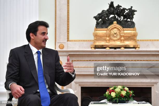 Emir of Qatar Sheikh Tamim bin Hamad Al Thani speaks with Russian President during their meeting at the Kremlin in Moscow on July 15, 2018.