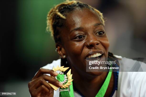 Lorraine Ugen of Great Britain celebrates with her gold medal after winning the Women's long jump at London Stadium on July 14, 2018 in London,...