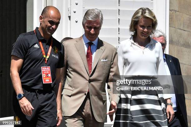 Belgium's head coach Roberto Martinez , King Philippe - Filip of Belgium and Queen Mathilde of Belgium smile as they walk at the Royal castle in...