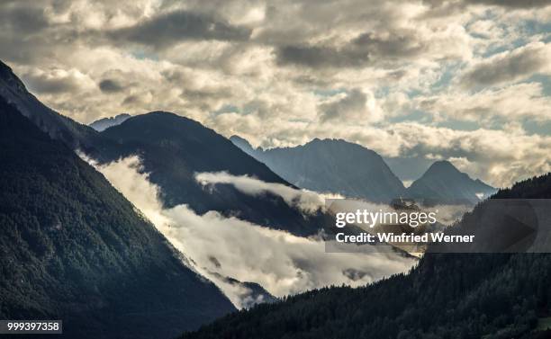 clouds deep mountains high - werner stock pictures, royalty-free photos & images