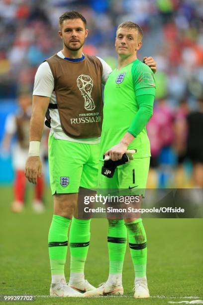 England goalkeepers Jack Butland and Jordan Pickford embrace each other after the 2018 FIFA World Cup Russia 3rd Place Playoff match between Belgium...