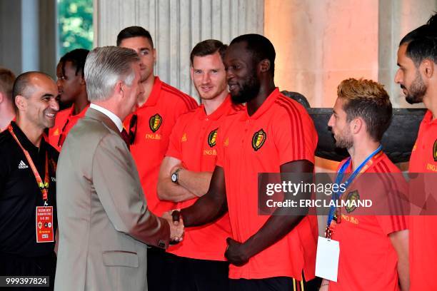 King Philippe - Filip of Belgium shakes hands with Belgian's forward Romelu Lukaku, accompanied with Belgium's head coach Roberto Martinez and team...