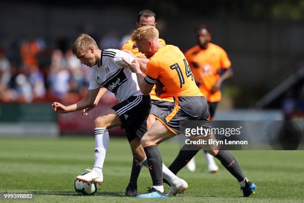 Paul McShane of Reading battles Jon Dagur Thorsteinsson of Fulham during the pre-season friendly between Reading and Fulham at the EBB Stadium on...