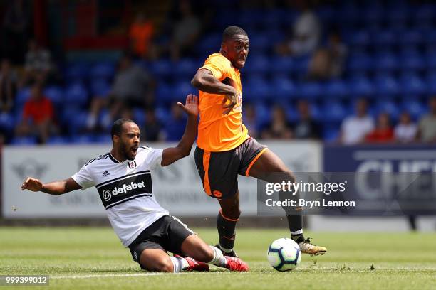 Yakou Meite of Reading is tackled by Ryan Sessegnon of Fulham during the pre-season friendly between Reading and Fulham at the EBB Stadium on July...