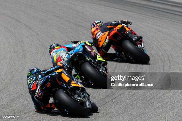 July 2017, Germany, Hohenstein-Ernstthal: German motorcycle Grand Prix, Moto2 at the Sachsenring: Brad Binder leads ahead of Joan Mir and Luca Marini...