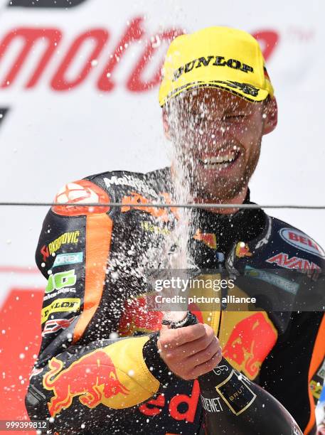 July 2017, Germany, Hohenstein-Ernstthal: German motorcycle Grand Prix, Moto2 at the Sachsenring: Brad Binder celebrates his win. Photo: Hendrik...