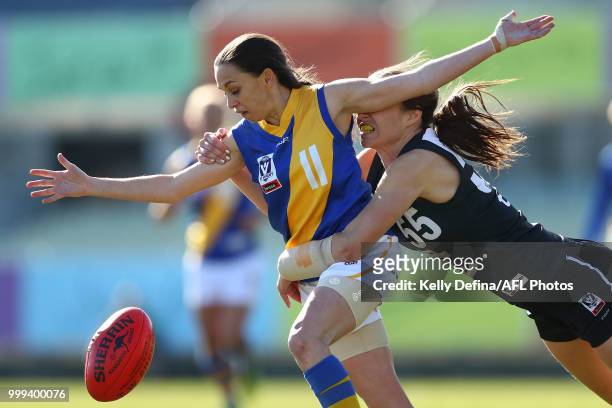 Kaitlin Smith of the Seagulls is tackled by Chloe Dalton of the Blues during the round 10 VFLW match between Carlton and Williamstown Seagulls at...