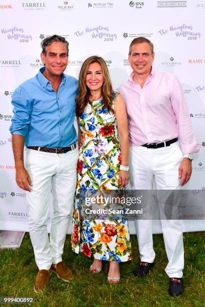 Michael Nierenberg, Maria Fishel and Kenneth Fishel attend The Samuel Waxman Cancer Research Foundation 14th Annual The Hamptons Happening on July...
